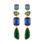 Gold-tone drop earrings featuring blue, teal, and clear faceted stones in a layered geometric design on white