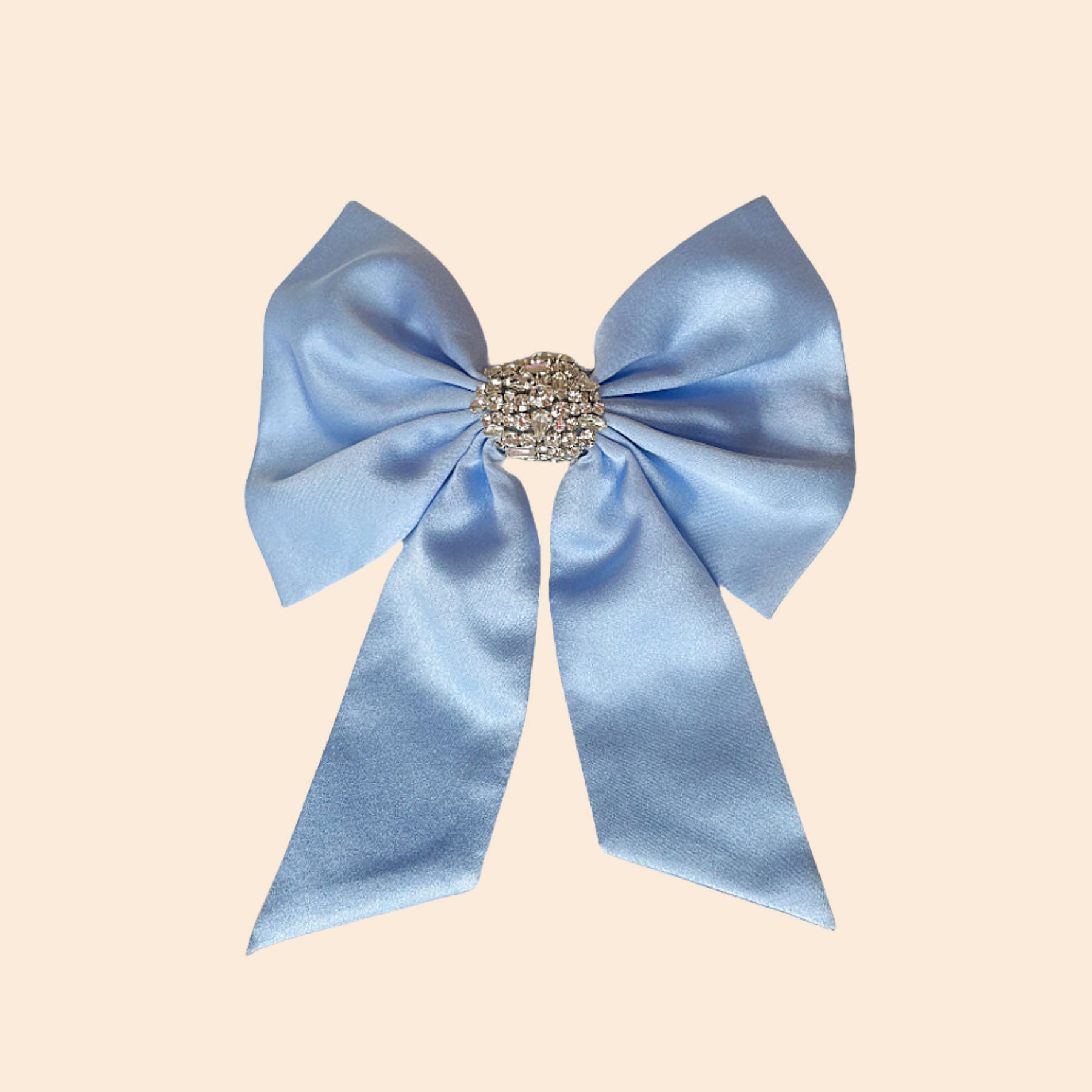 Carolina Blue and Clear Crystal Hair Bow on Tan Background
