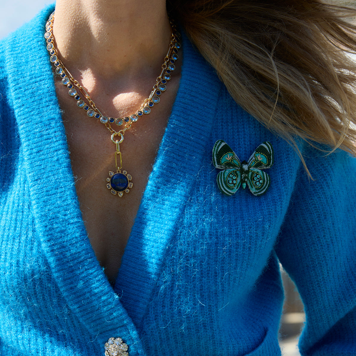 Green Butterfly Beaded and Embroidered Brooch on Mignonne Gavigan styled on a blue cardigan 2