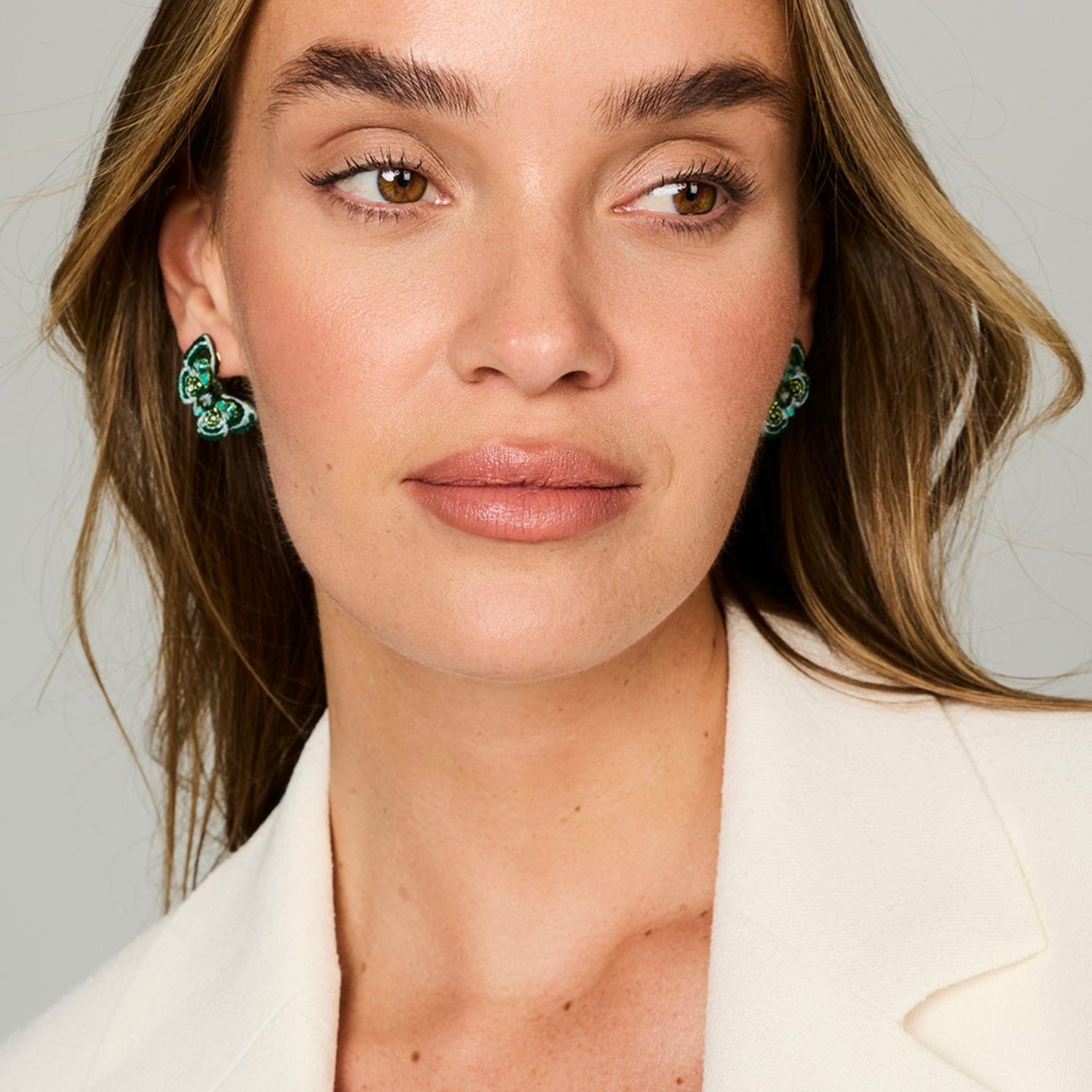 Green Butterfly Beaded and Embroidered Earrings on a model 
