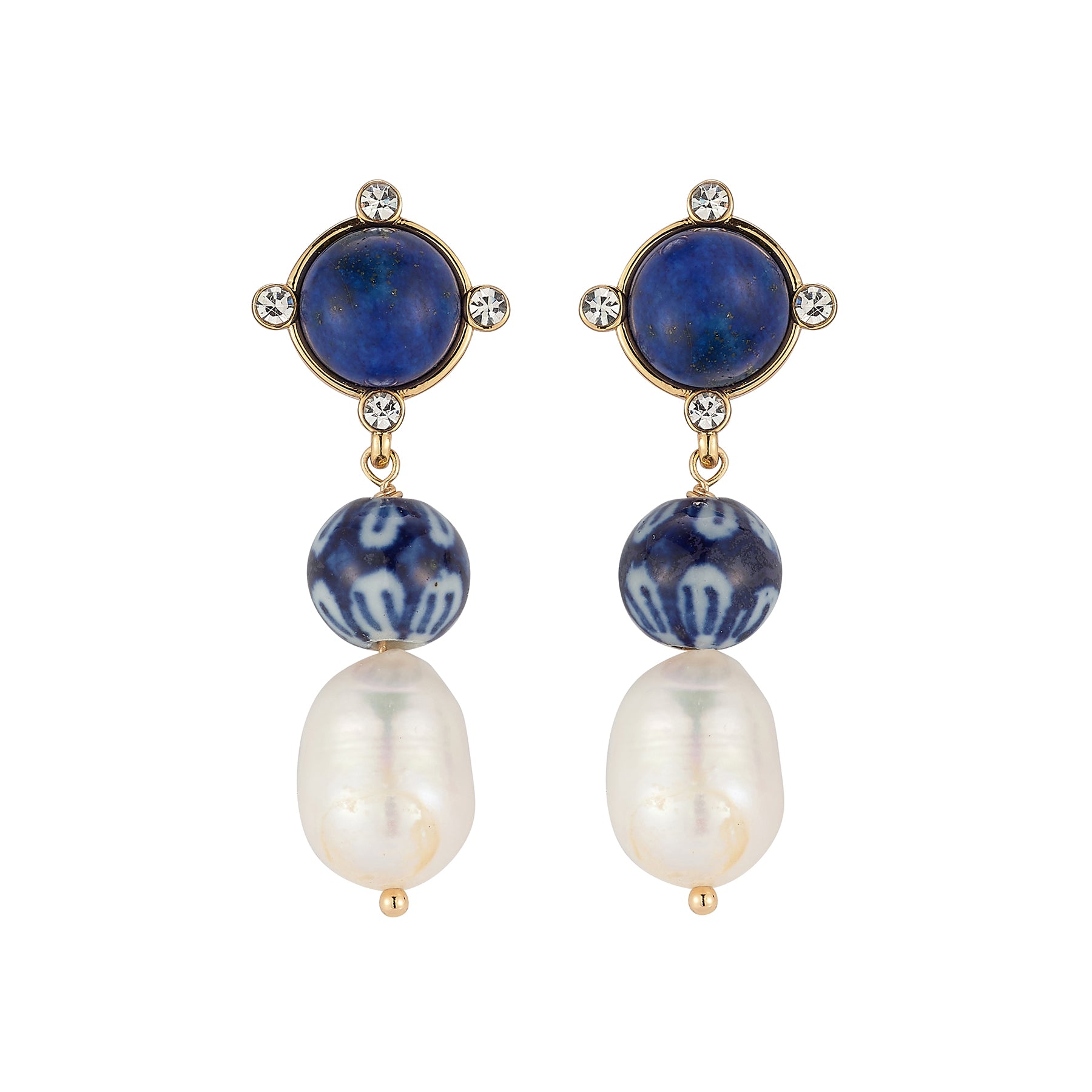 A pair of gold-tone drop earrings featuring round navy blue lapis lazuli stones, patterned blue and white beads, and large white baroque pearls, set against a plain white background.
