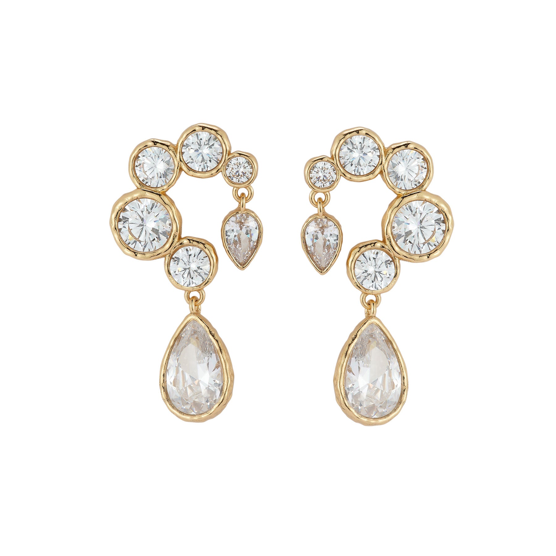 Gold and crystal earrings on a white background