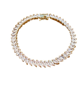 Clear Crystals and Gold Tennis Bracelet on Flat White Background
