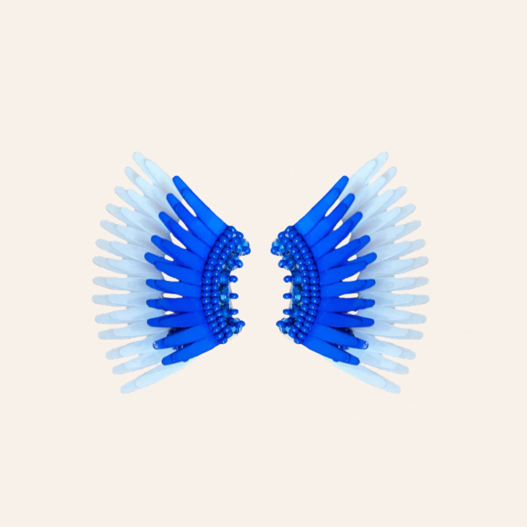 Blue and White Sequin Wing Stud Earrings on Tan Background