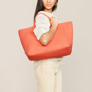 Large Woven Neoprene Coral Tote Styled on Model in Cream Outfit