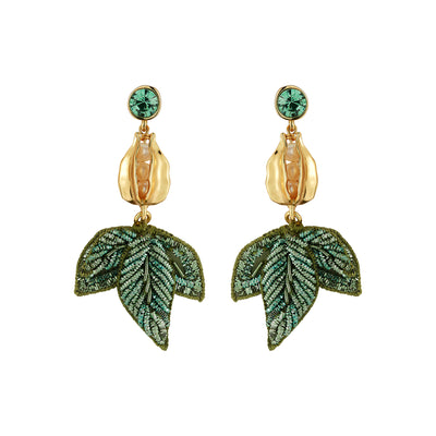 A pair of gold and green drop earrings featuring a round green crystal stud, a textured gold flower bud, and a dangling green embroidered leaf below, set against a plain white background.