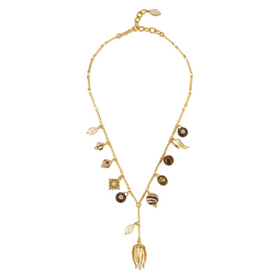 Gold charm necklace against a white background