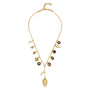 Gold charm necklace against a white background