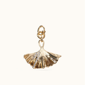 Gold and Crystal Ginkgo Leaf Charm on Tan Background