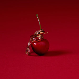 Crystal and Gold Hoop Set Staged on Cherry with Red Background