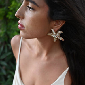 Crystal and Gold Starfish Stud Earrings on Model