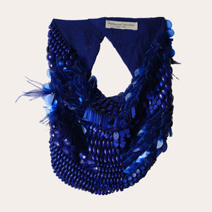 Dark Blue Beaded Scarf Necklace on Flat Off-White Background