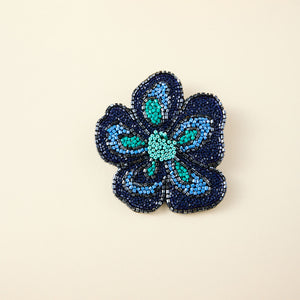 Blue Beaded Flower on Tan Background