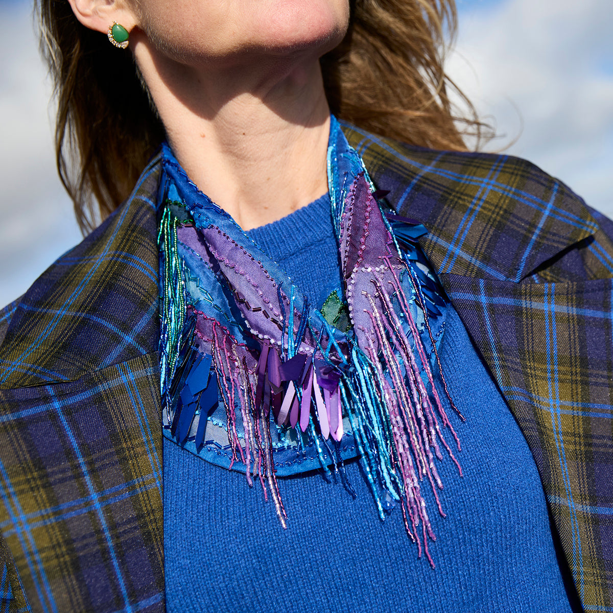 Blue patterned, beaded and embroidered scarf necklace featuring colorful pink and purple details on Mignonne Gavigan Close Up 