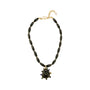 Black beaded necklace featuring a gold-tone Semi Precious Black Onyx pendant with green, navy, blue and clear accents on white