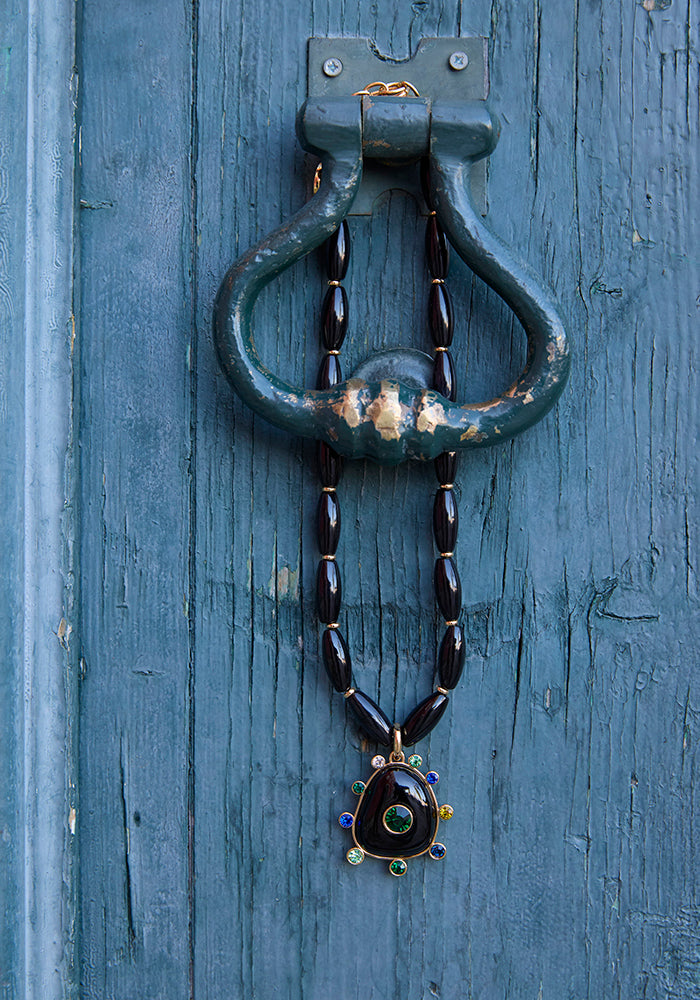 Black Onyx Statement Necklace on a blue background