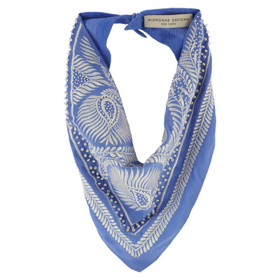 A blue and white patterned neck scarf with a paisley and leaf design, featuring a small silver-tone chain detail along the edge, displayed on a clean white background.