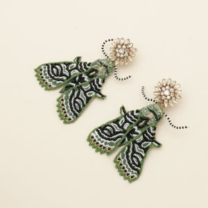 Emerald and Black Beaded and Embroidered Moth Drop Earrings with Champagne Crystal Topper on Tan Background