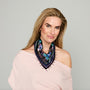 Black scarf necklace featuring colorful floral and geometric embroidery with beaded details on model