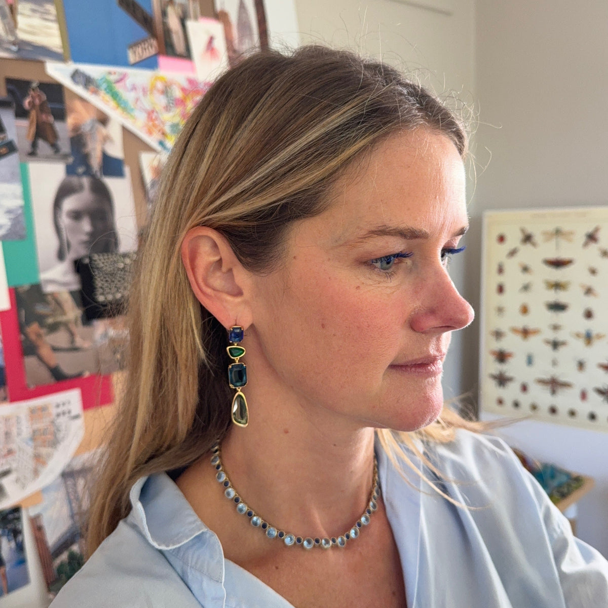 Delicate necklace featuring a strand of small blue beads and a gold-tone clasp on Mignonne Gavigan