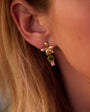 Model wearing palm tree shaped stud earrings, the Fabiana Studs