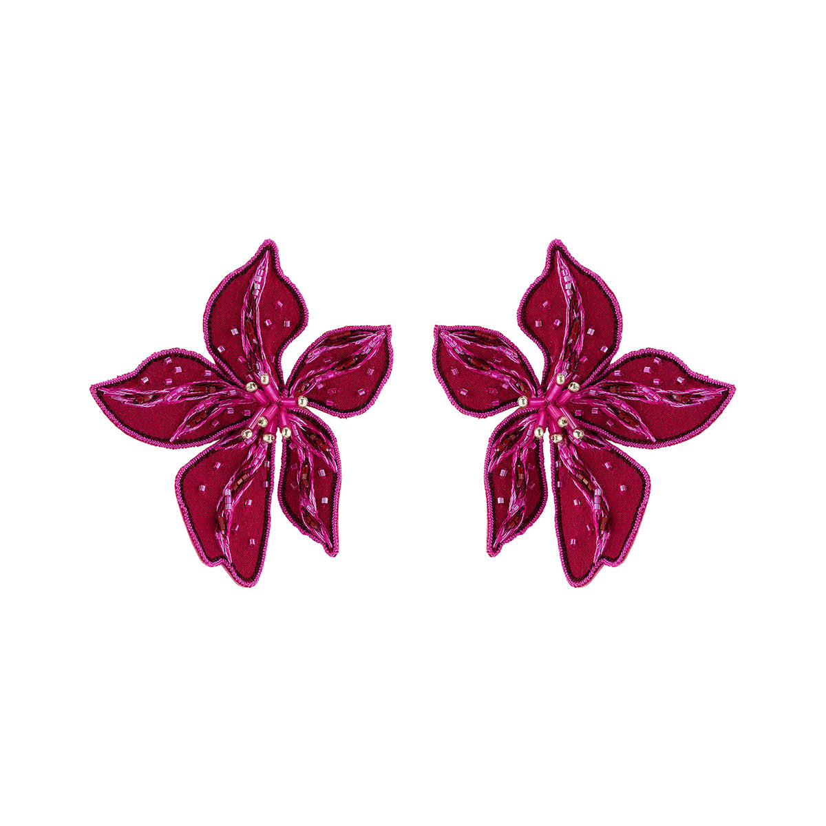 Magenta flower-shaped statement earrings featuring layered petals and intricate beadwork on white