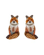 A pair of fox-shaped earrings crafted with orange and brown sequins, white faux fur details, and rhinestone embellishments on a plain white background.