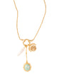 Gold necklace with charms on a white background