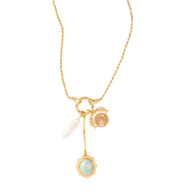 Gold necklace with charms on a white background