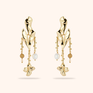 Freshwater Pearl and Stone Heart and Flower Drop Earrings on Tan Background