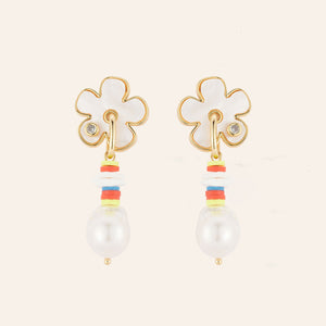 Flower and Multi Bead Pearl Drop Earrings on Tan Background