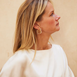 Gold and Pearl Hoop Earrings Styled on Maggie in White Silk Blouse