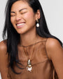 Model wearing Gloria Drop Earrings and Gloria Necklace