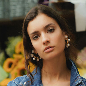 Pearl and Gold Hoop Earrings Styled on Model in. Jean Jacket