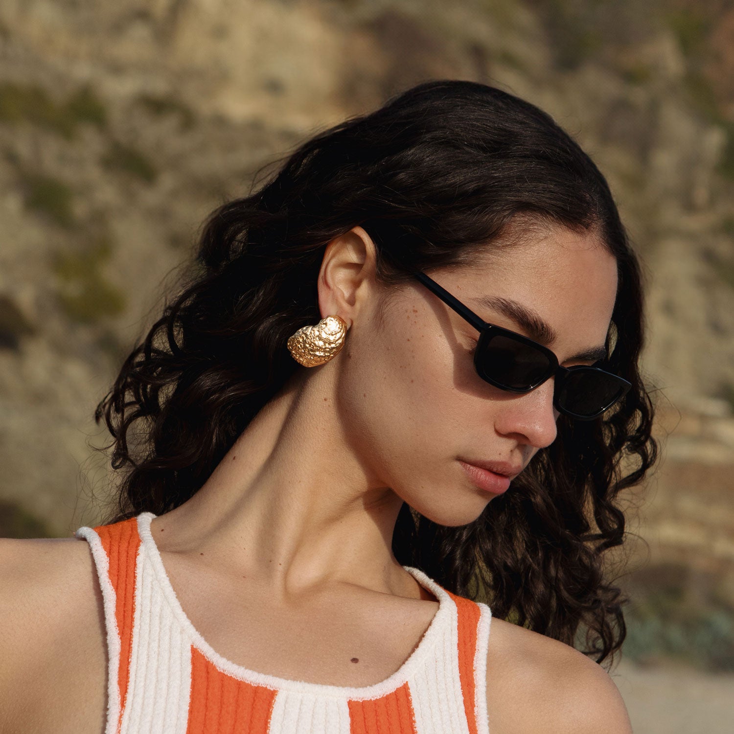Gold Oyster Shell Stud Earrings Styled on Model