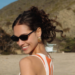 Gold Oyster Shell Stud Earrings Styled on Model