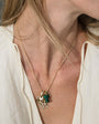 Gold, Stone, and Crystal Pendant Charm Necklace Styled on Model