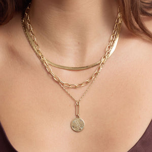 Gold Compass Pendant Necklace, Gold Herringbone Necklace, and Gold Chain Necklace Styled on Model