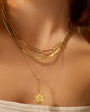 Gold Compass Pendant Necklace, Gold Herringbone Necklace, and Gold Paperclip Necklace Styled on Model