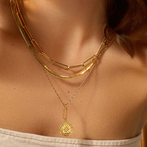 Gold Compass Pendant Necklace, Gold Herringbone Necklace, and Gold Paperclip Necklace Styled on Model