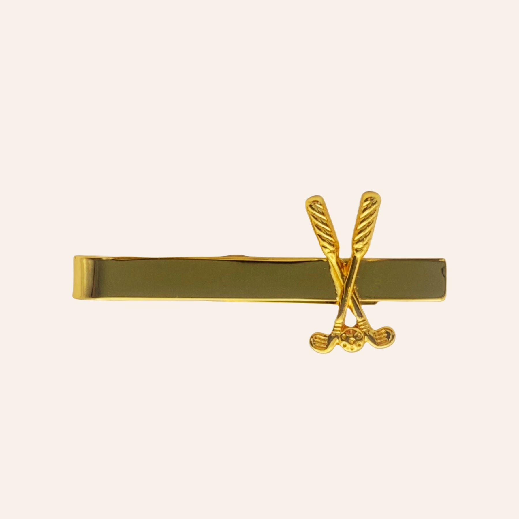 Gold Golf Clubs and Ball Tie Bar on Tan Background