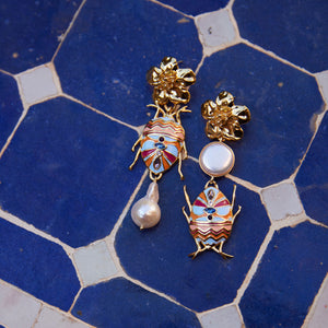 Pearl Enamel and Gold Drop Earrings Staged on Tile Floor