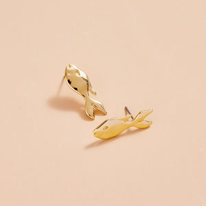 Gold Fish Stud Earring Styled on Cream Background