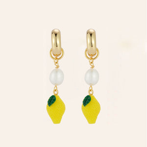 Lemon Bead, Freshwater Pearl, and Gold Hoop Drop Earrings on Tan Background