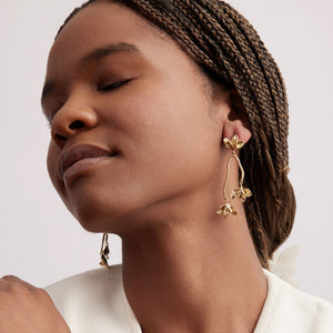 Gold Flower Drop Earrings Styled on Model