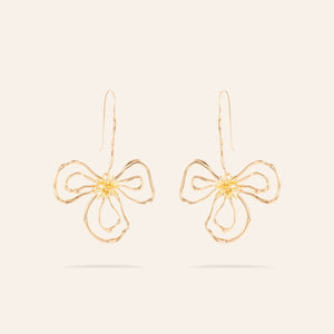 Gold Organic Flower Drop Earrings On Cream Background