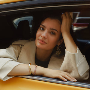 Gold Organic Shaped Flower Earrings Styled on Model