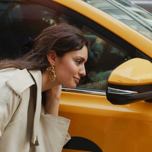 Gold Organic Shaped Flower Earrings Styled on Model