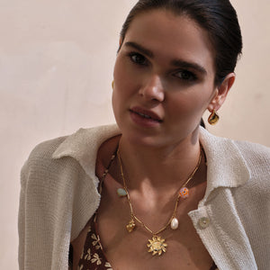 Gold Stud Earrings Styled on Model with Charm Necklace