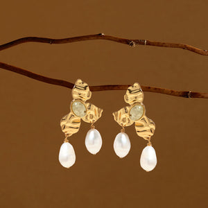 Semi-Precious Prehnite, Gold, and Pearl Drop Earrings Staged on Branches with Brown Background
